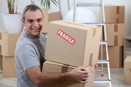Family preparing for home move with packed boxes