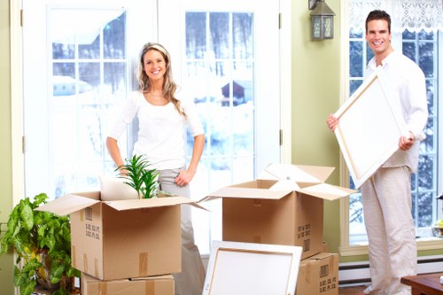 Professional movers assisting with packing